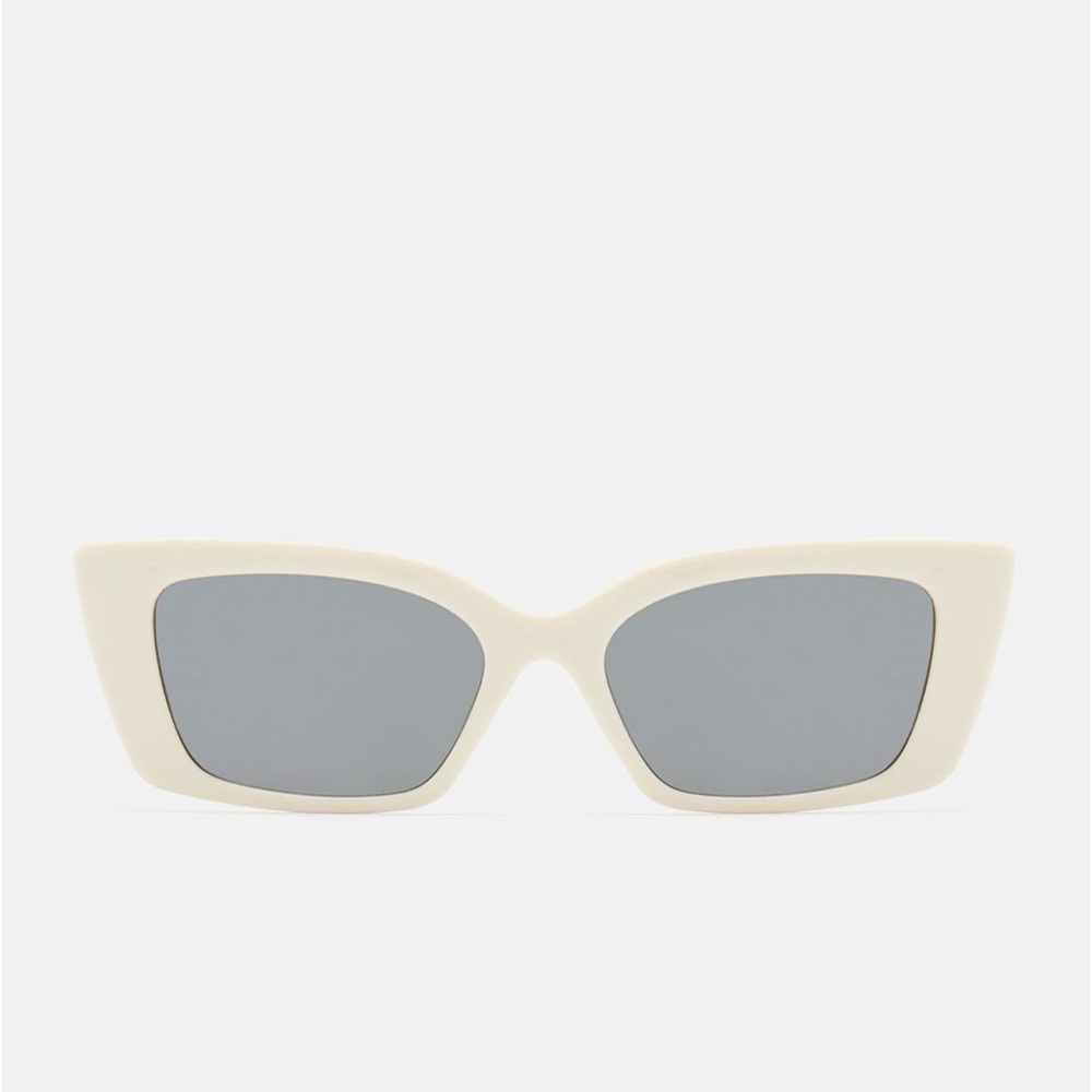 Beige sunglasses with gold design on the side